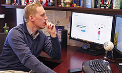 Brandon Welch, Ph.D., works at his computer